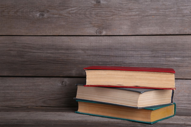 Old vintage books on grey wooden table