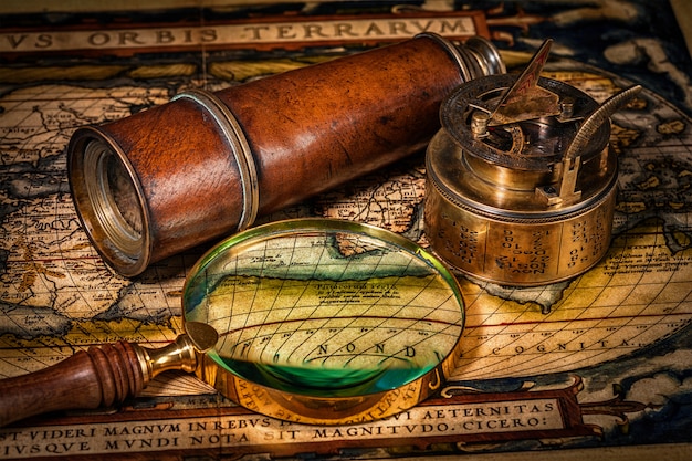 Old vintage compass on ancient map