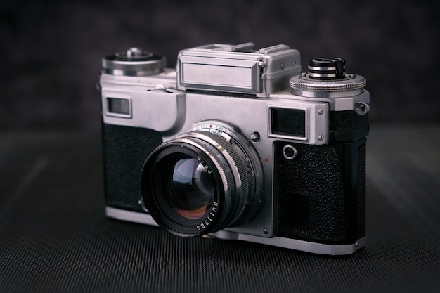 Old vintage film 36mm photo camera, lifestyle memory. Take pictures with a manual lens history.