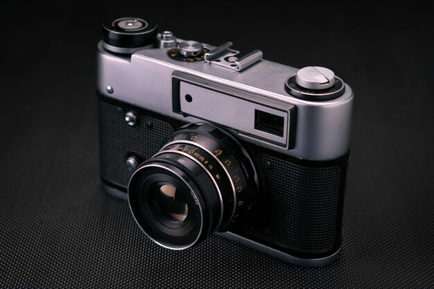 Old vintage film 36mm photo camera, lifestyle memory. Take pictures with a manual lens history.