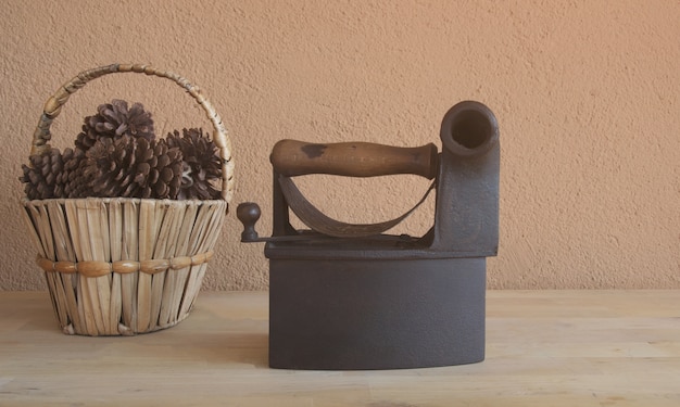 Old vintage iron and basket of dried pineapple 