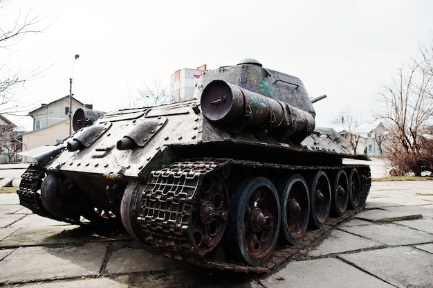 Old vintage military tank in the city pedestal.