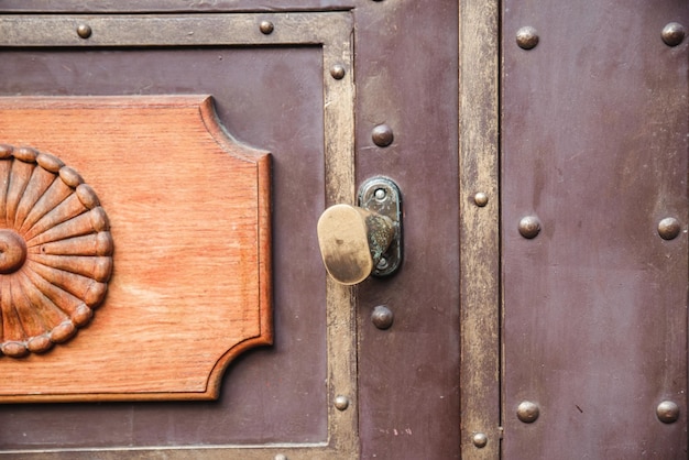 Old vintage wooden doors close up with lock