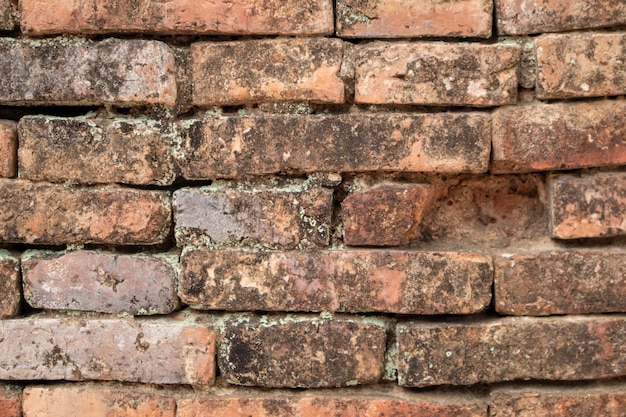 old wall was destroyed, built from red bricks.