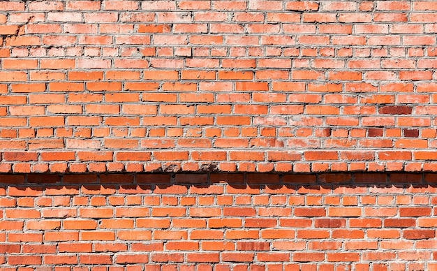 An old weathered red brick wall Background and texture of brickwork