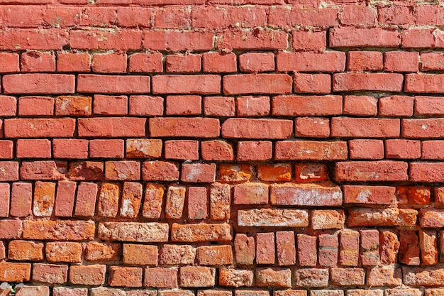 Old weathered red brick wall