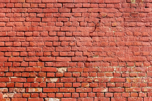 Old weathered wall of red brick. Abstract background