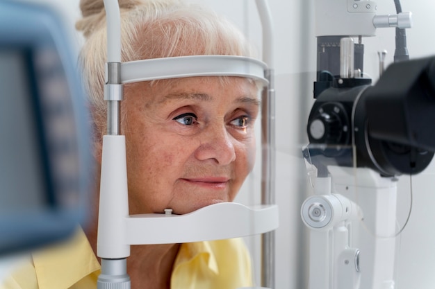 Old woman having an eye sight check at an ophthalmology clinic