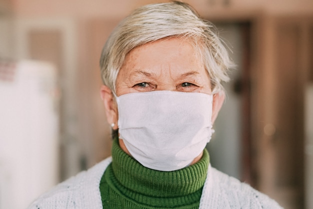 Old woman wearing medical mask