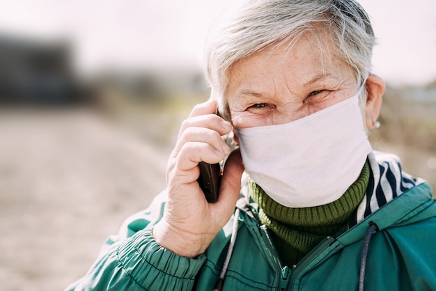 Old woman wearing medical mask