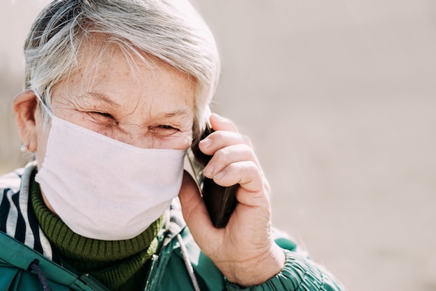 Old woman wearing medical mask