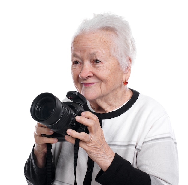 Old woman with photo camera isolated