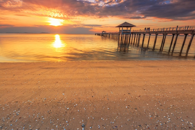 Old wood bridge pier  against beautiful sunset sky use for natural background 