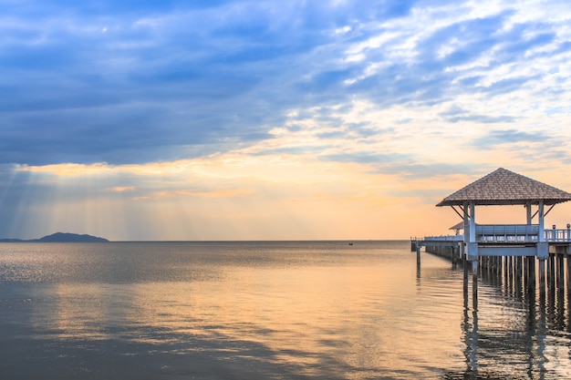 Old wood bridge pier  against beautiful sunset sky