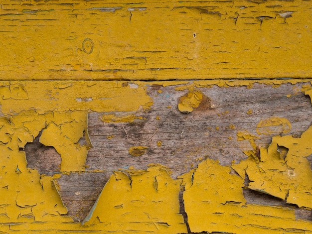 Old wooden background of boards with cracked and peeling paint