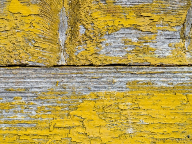 Old wooden background of boards with cracked and peeling paint