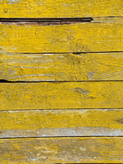 Old wooden background of boards with cracked and peeling paint