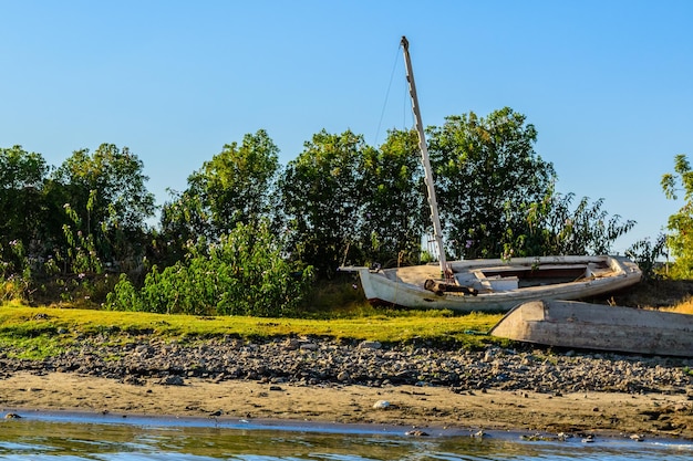 Old wooden boats on a bank of the Nile river