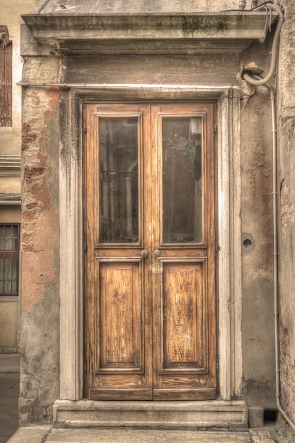 Old wooden door in Venice Italy Processed for sepia tone effect