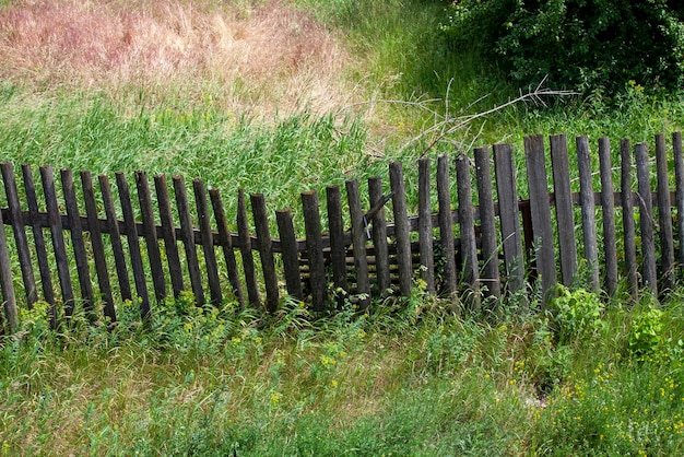 An old wooden fence in the countryside