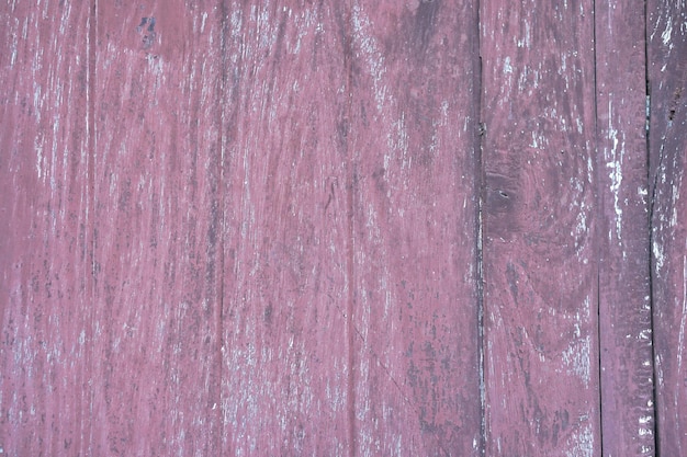 The old wooden floor has a pattern of decay