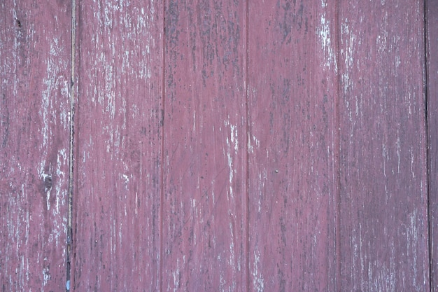 The old wooden floor has a pattern of decay