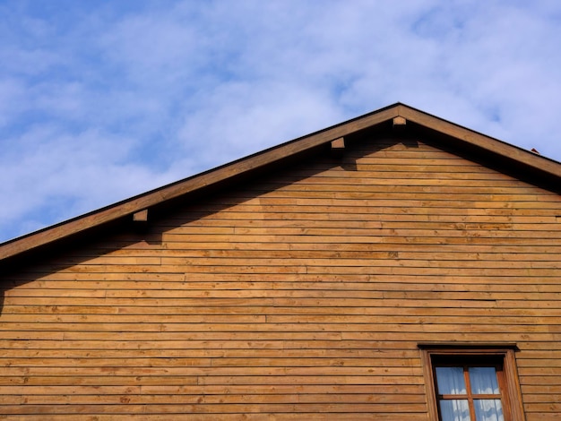 Old wooden house and blue sky