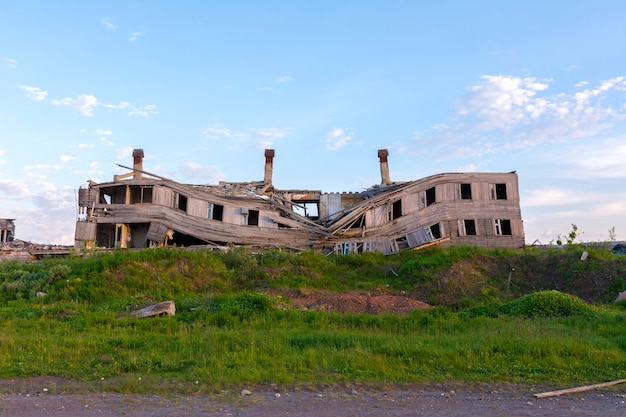 An old wooden rickety barrack in the empty city of Komsomolsky Vorkuta