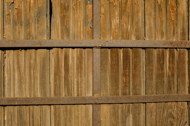 Old wooden wall with vertical slats. clarity throughout the frame. High quality photo