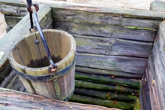 Old wooden well and a wooden bucket