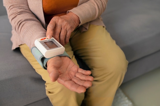 Older person checking their blood pressure with tensiometer