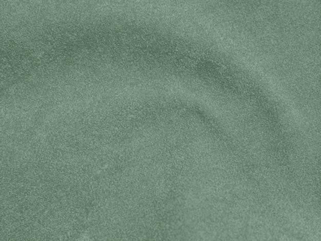 Olive green color velvet fabric texture used as background light Olive green fabric background of soft and smooth textile material There is space for text