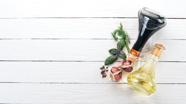 Olive oil and soy sauce in glass jars Spices and Sauce Top view On a white wooden background Free space for text