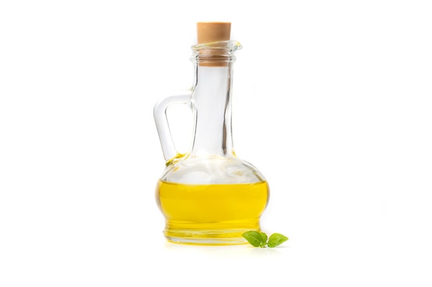 Olive or sunflower yellow oil on a bottle with stopper, isolated on a white background.