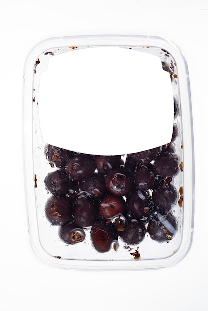 Olives in plastic box surface