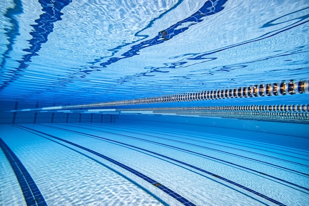 Olympic Swimming pool under water background.