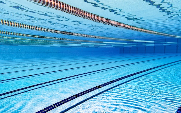 Olympic Swimming pool under water background.