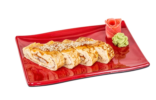 Omelet Maki Sushi Roll made of Smoked Eel inside Topped with Tamago Japanese Omelet and Sauce