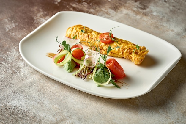 Omelet with avocado mousse and salmon in a plate Selective Focus Noise in postproduction