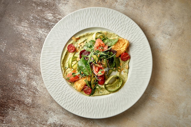 Omelet with avocado mousse and salmon in a plate Selective Focus Noise in postproduction