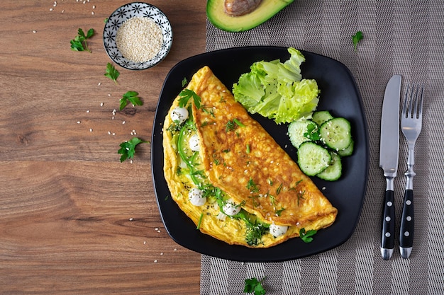 Omelette with mozzarella cheese and avocado Ketogenic keto diet breakfast Top view copy space