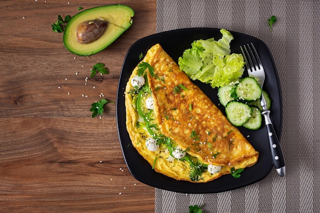 Omelette with mozzarella cheese and avocado Ketogenic keto diet breakfast Top view copy space