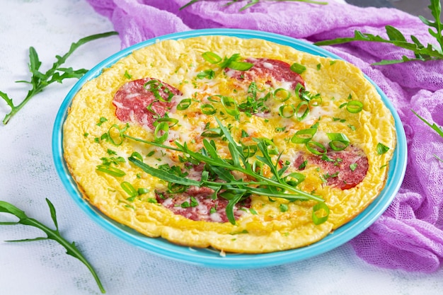 Omelette with sausage herbs and grated cheese Easy breakfast