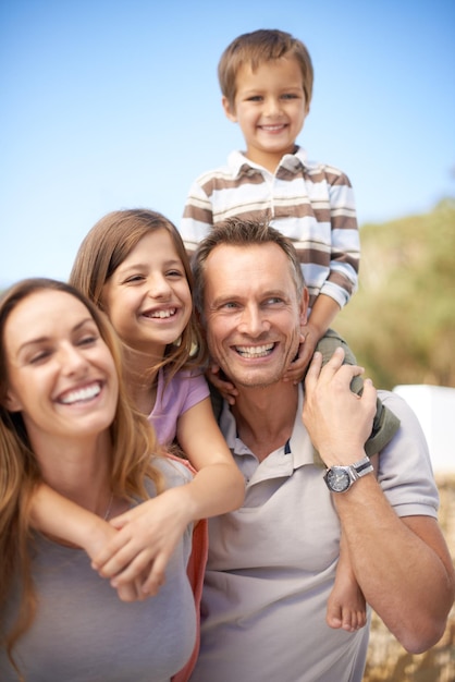 One awesome family adventure Portrait of a happy family of four having fun while on holiday