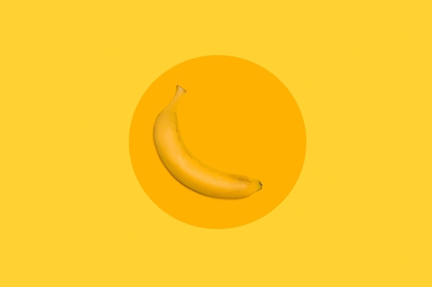 One banana on a yellow round background and on other yellow background with copy space