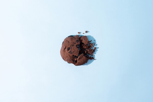 One broken chocolate chip cookie, top view