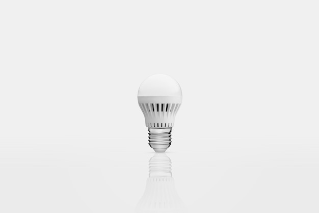 One energy saving lamp on a white background with reflection