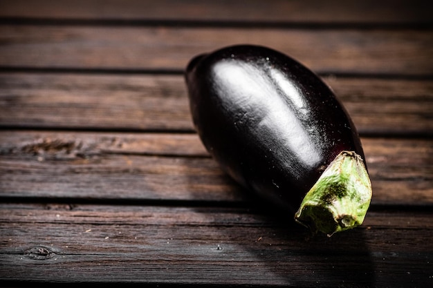 One fresh eggplant on the table