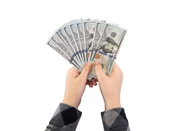 One hundred dollar bills in the hands of a business woman isolated on white background.