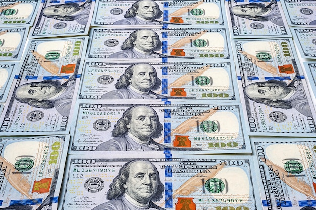 One hundred US dollars background A large number of notes A pile of American dollars banknotes